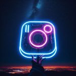 Instagram logo made with neon in the night sky
